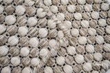 Ribbed flatweave wool rug styled in a living room
