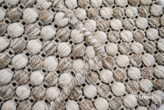 Ribbed flatweave wool rug styled in a living room