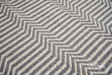 Chevron flatweave wool rug styled in a living room