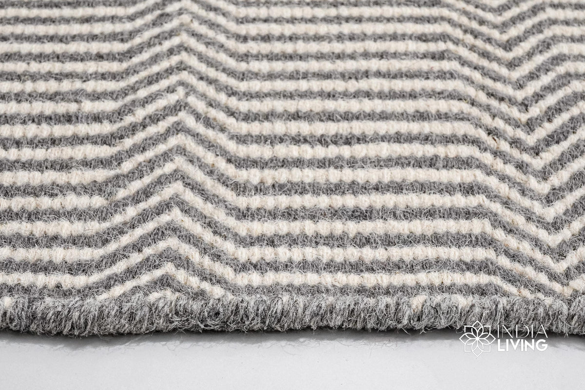Light grey wool rug in a boho-styled entryway