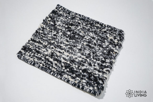 Ivory black textured wool rug, flat lay view