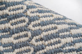 Bluish grey wool rug placed under a coffee table