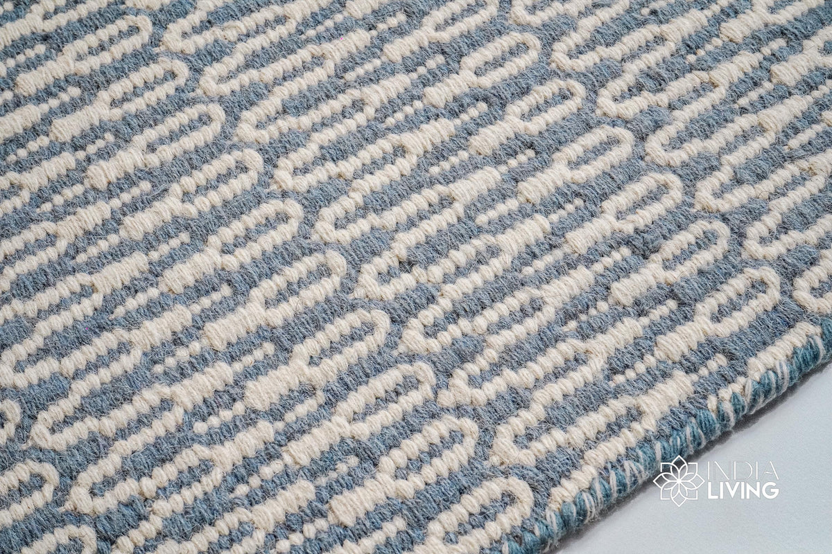 Bluish grey wool rug in a modern bedroom