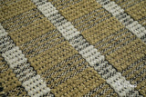 Olive green flatweave rug in a Scandinavian-style bedroom