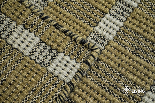 Olive green wool rug styled in a modern living room