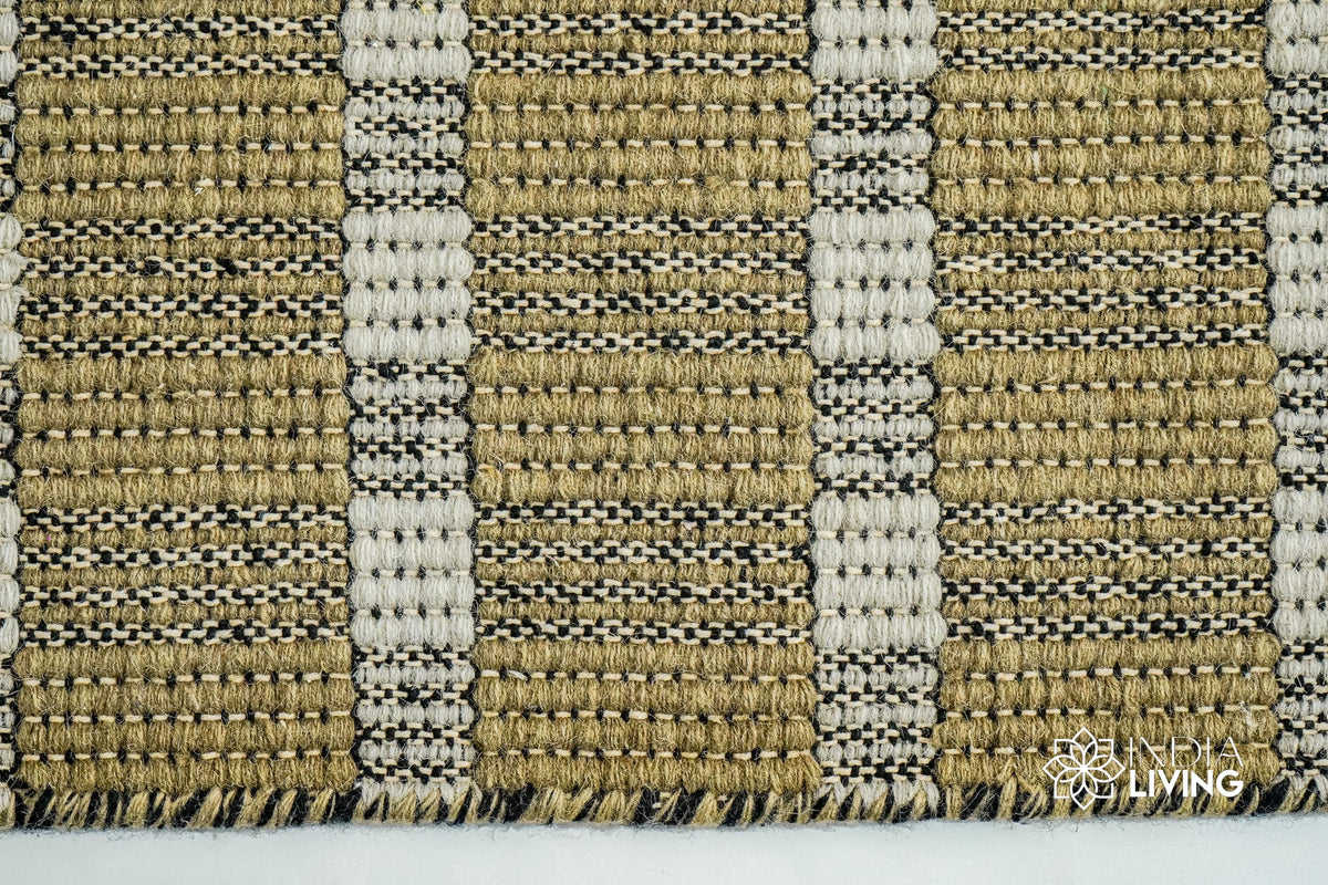 Olive green wool rug texture close-up showing handwoven weave