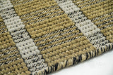 Top-down view of olive green geometric striped wool rug