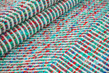 Multi blend teal blue wavy striped wool rug, flat lay view