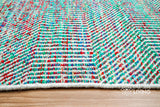 Multi blend teal wool rug texture close-up showing handwoven weave