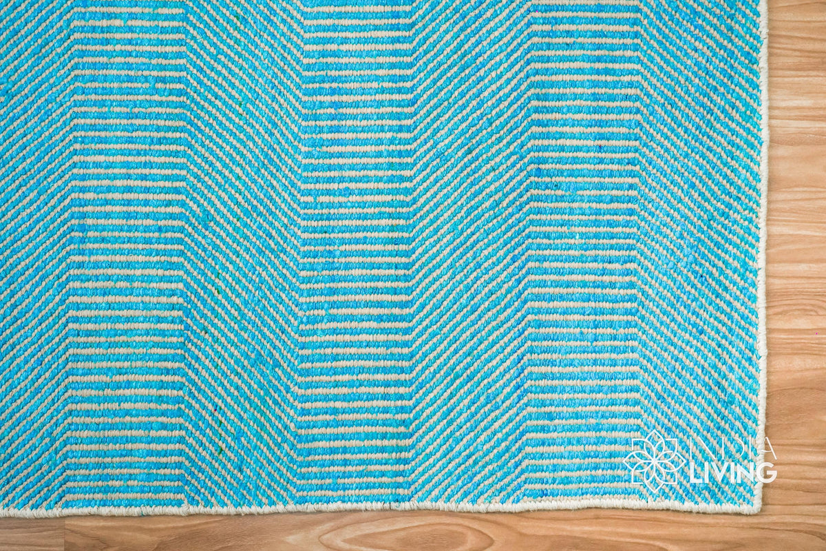 Aqua blue wool rug under a coffee table