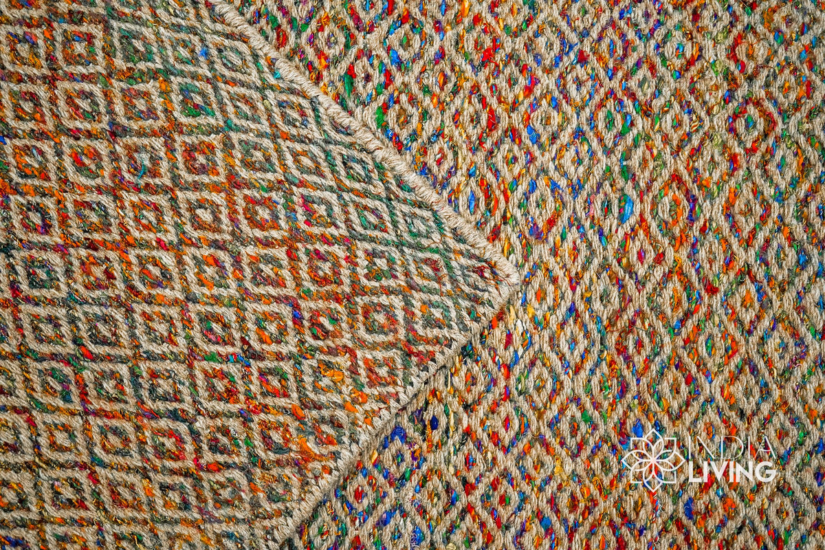 Multi blend diamond flatweave rug in a bedroom setting