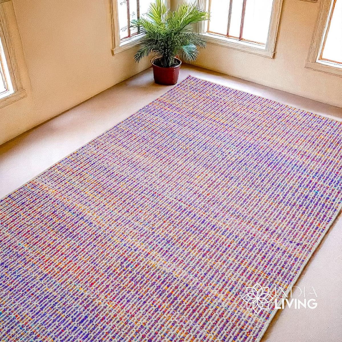 Purple multi blend wool rug styled in a living room