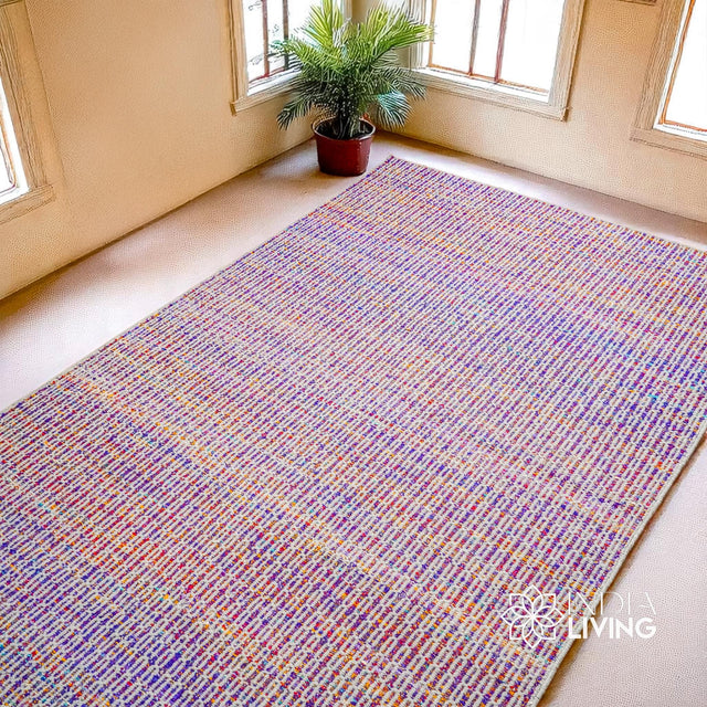 Purple multi blend wool rug styled in a living room