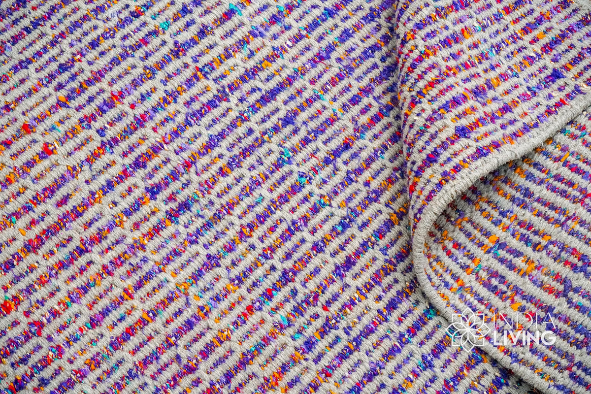 Purple wool rug under a coffee table