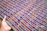 Purple flatweave rug in a bedroom setting