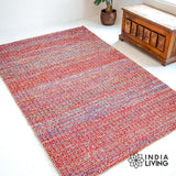 Multi blend red wool rug under a coffee table