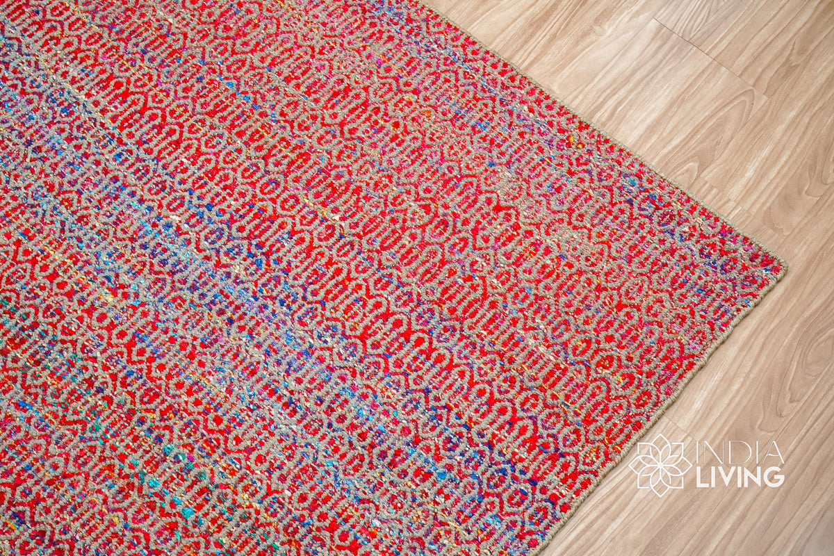 Multi blend red wool rug texture close-up showing handwoven weave