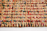 Top-down view of natural multicolour ribbed jute rug