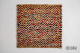 Natural jute chevron rug in a bright entryway setting