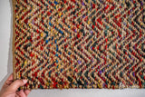 Natural jute chevron rug styled in a living room