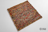 Natural jute chevron rug under a coffee table