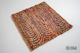 Natural jute ripple rug under a coffee table