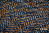 Herringbone flatweave rug in a hallway entryway