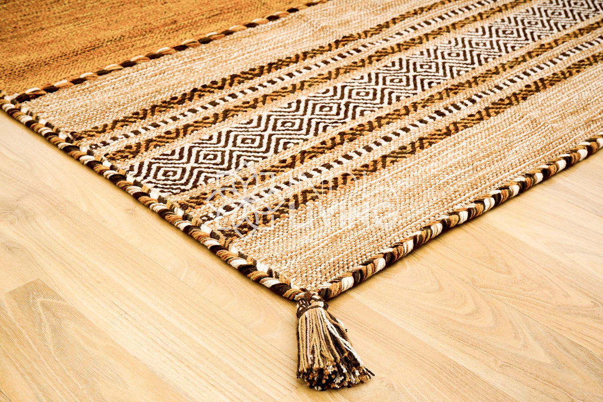 Corner detail of handwoven brown kilim rug