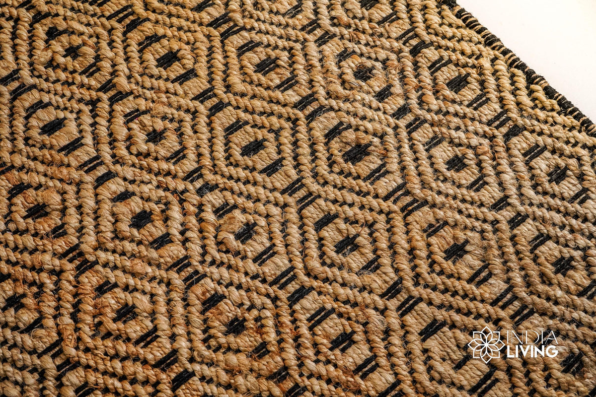Natural jute diamond rug styled in a boho living room