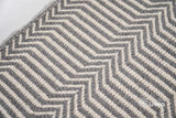 Light grey wool rug in a modern bedroom