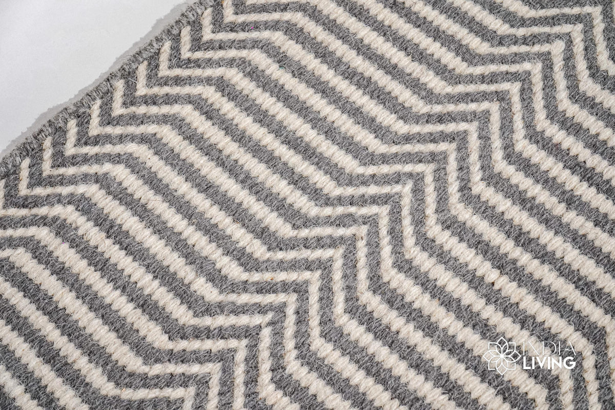 Light grey wool rug in a modern bedroom