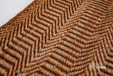 Close-up of chevron weave texture on natural jute rug