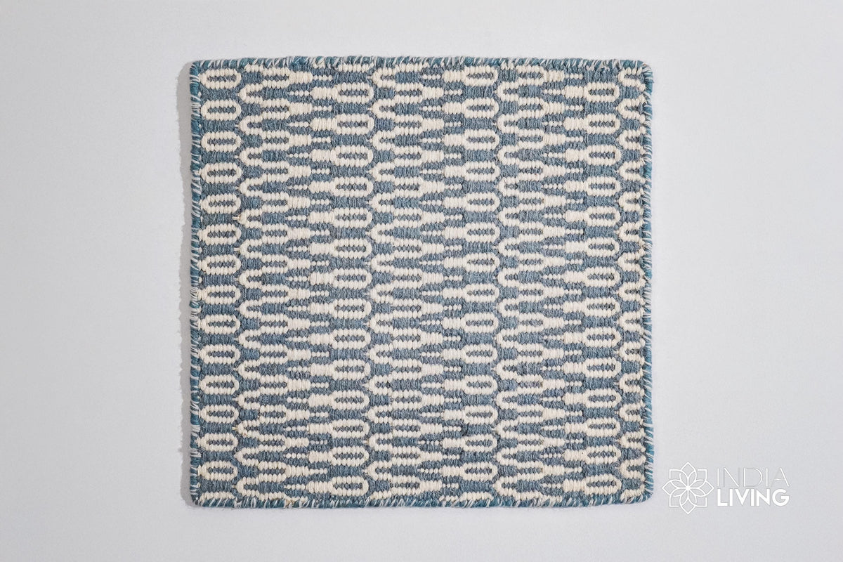 Close-up of geometric wool weave texture in bluish grey