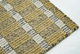 Olive green flatweave rug corner detail showing stripe pattern