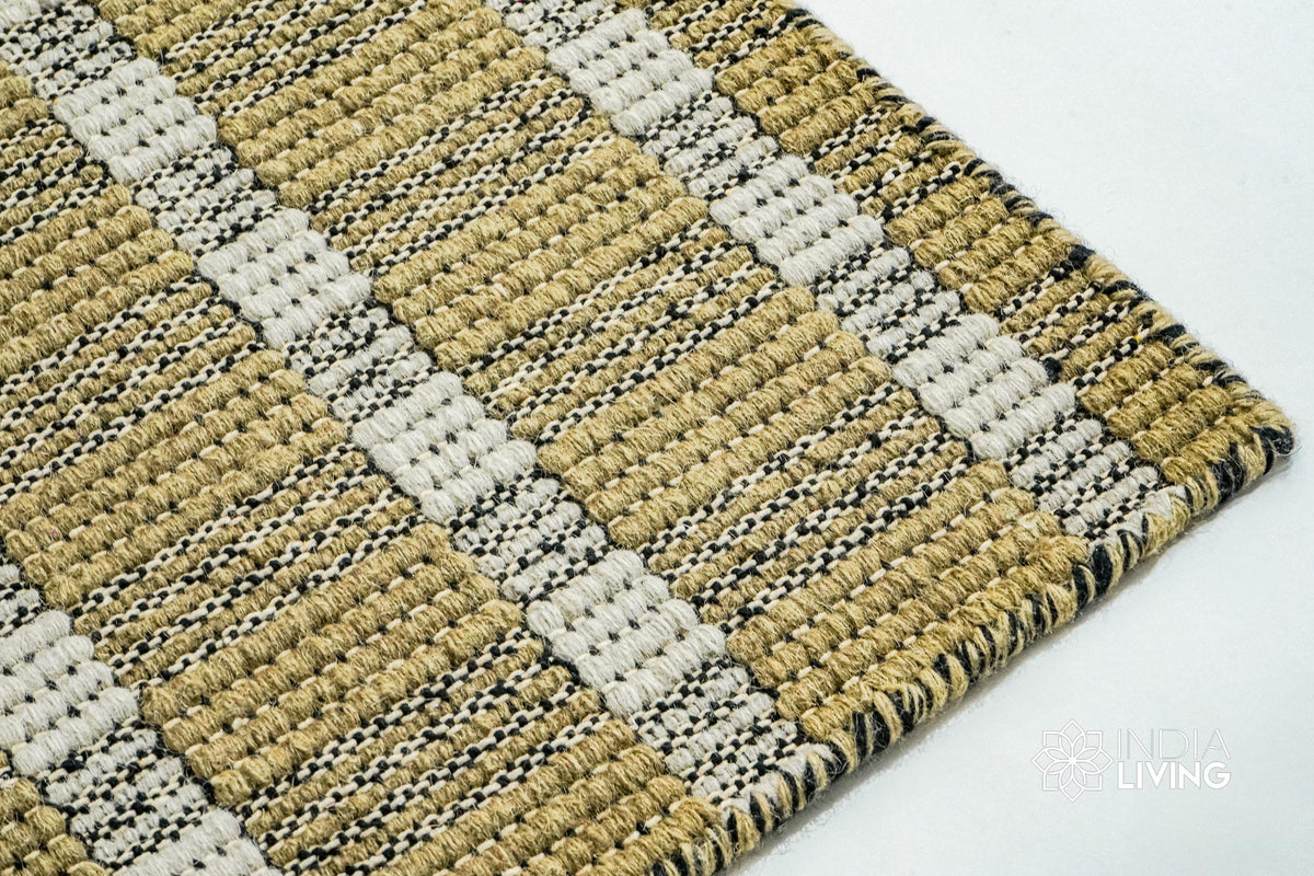 Olive green flatweave rug corner detail showing stripe pattern