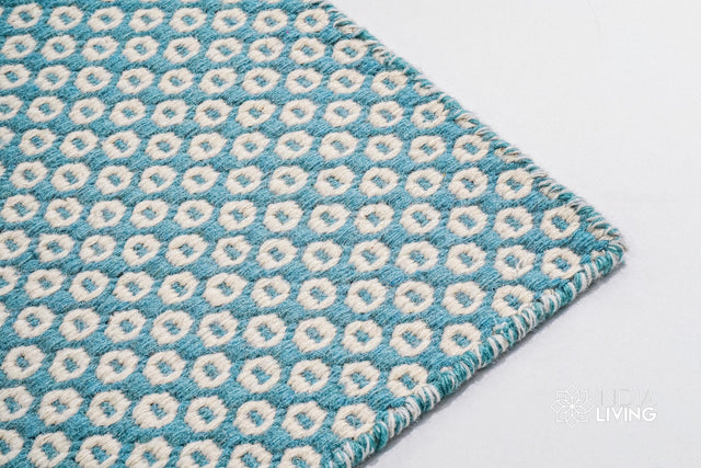 Turquoise blue honeycomb texture wool rug, flat lay view