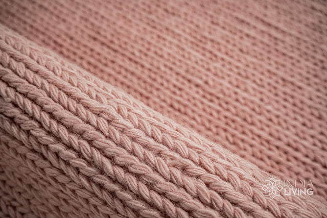 Light pink sumac braided wool rug close-up knit texture
