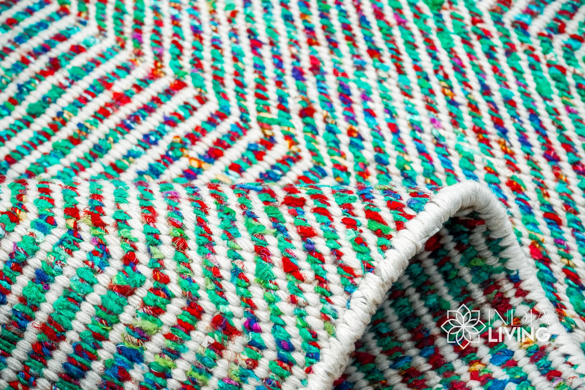 Top-down view of multi blend teal wavy striped rug