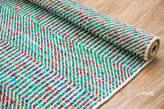 Multi blend teal wool rug styled in a modern living room