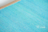 Close-up of aqua blue chevron weave wool texture