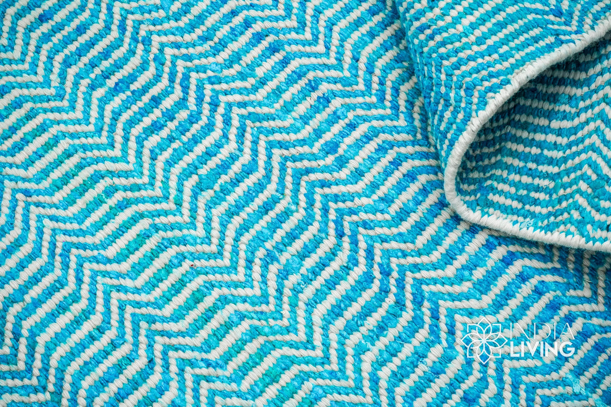 Aqua blue flatweave rug corner detail
