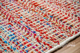 Multi blend red wool rug under a coffee table