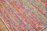 Top-down view of multi blend red chevron rug