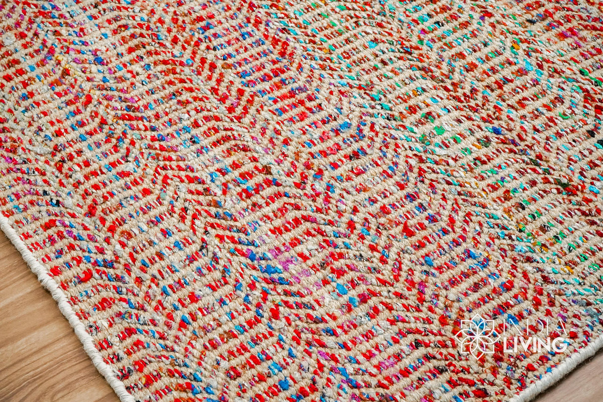 Top-down view of multi blend red chevron rug