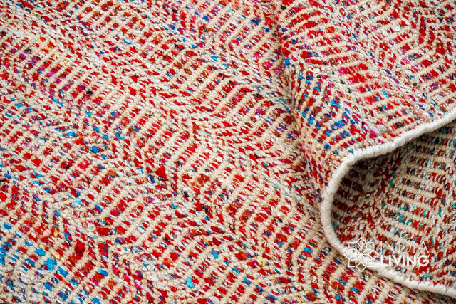 Multi blend red chevron wool rug styled in a living room