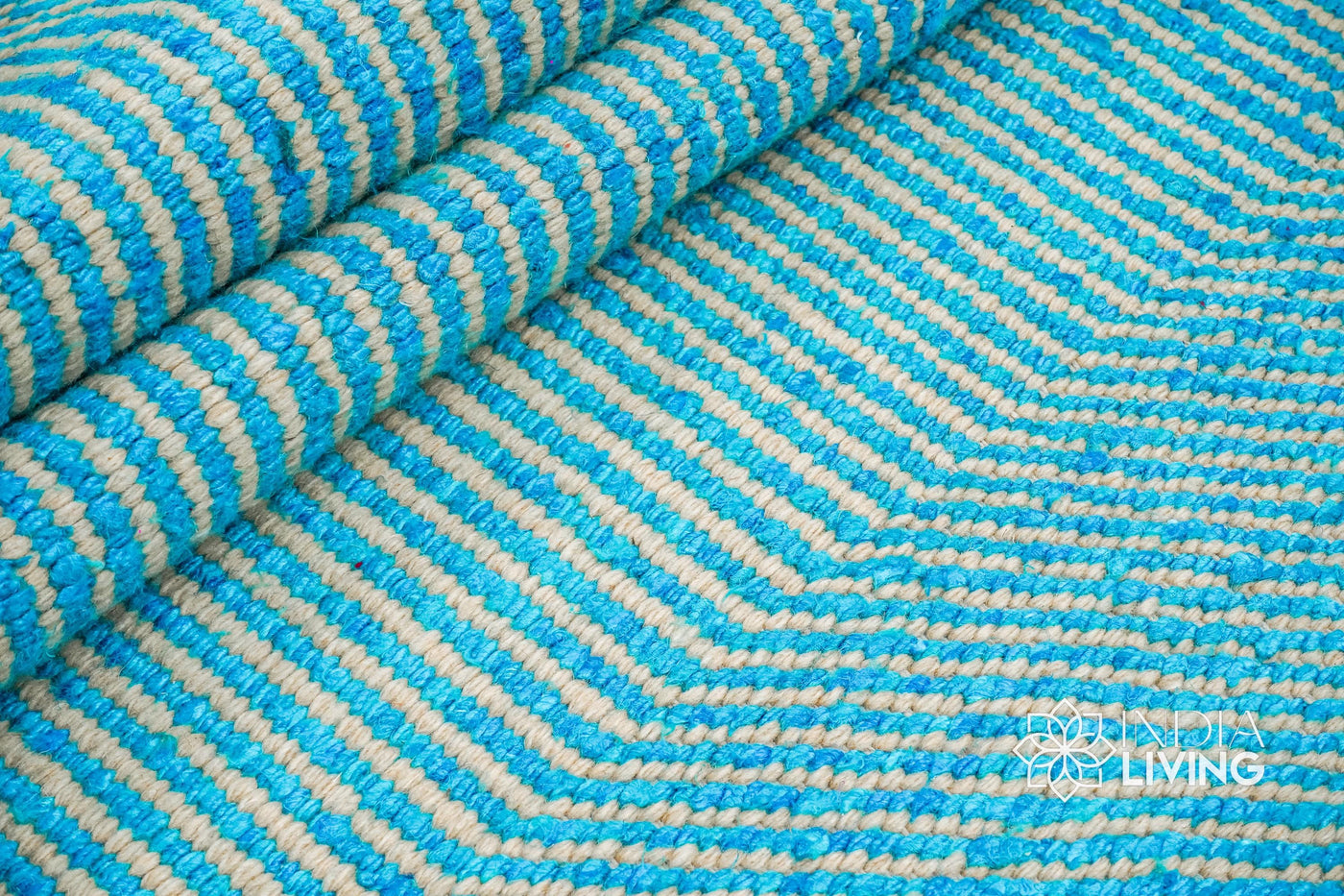 Aqua blue wavy striped texture wool rug, flat lay view