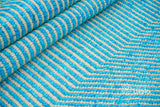 Aqua blue wavy striped texture wool rug, flat lay view
