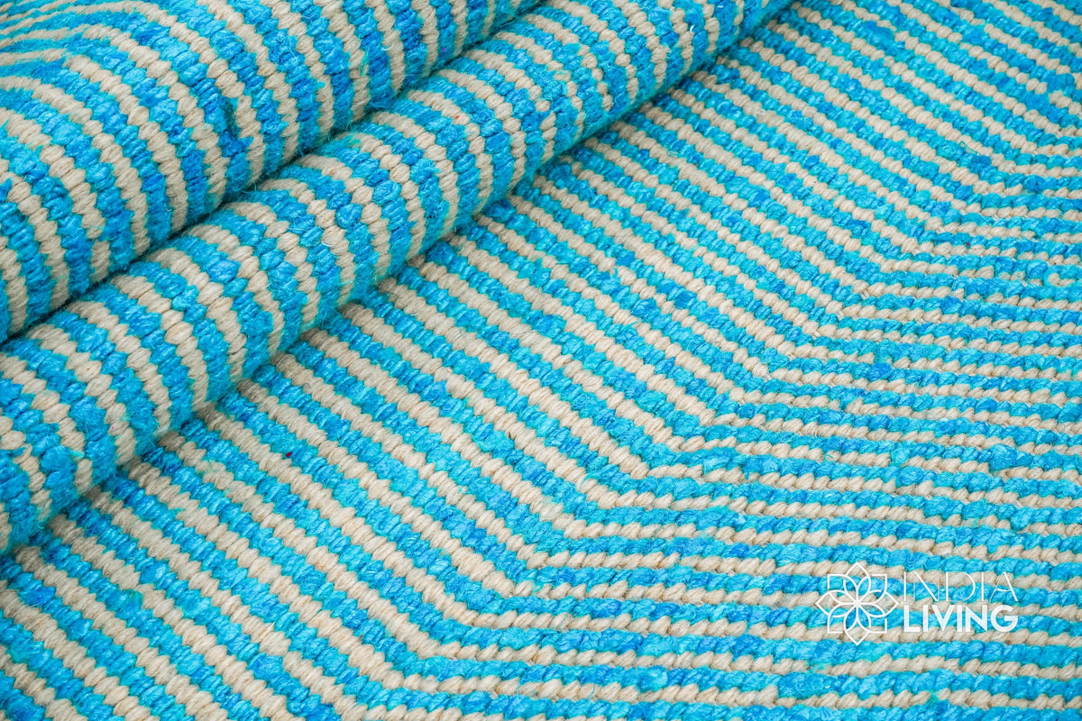 Aqua blue wavy striped texture wool rug, flat lay view