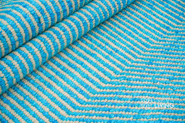 Aqua blue wavy striped texture wool rug, flat lay view
