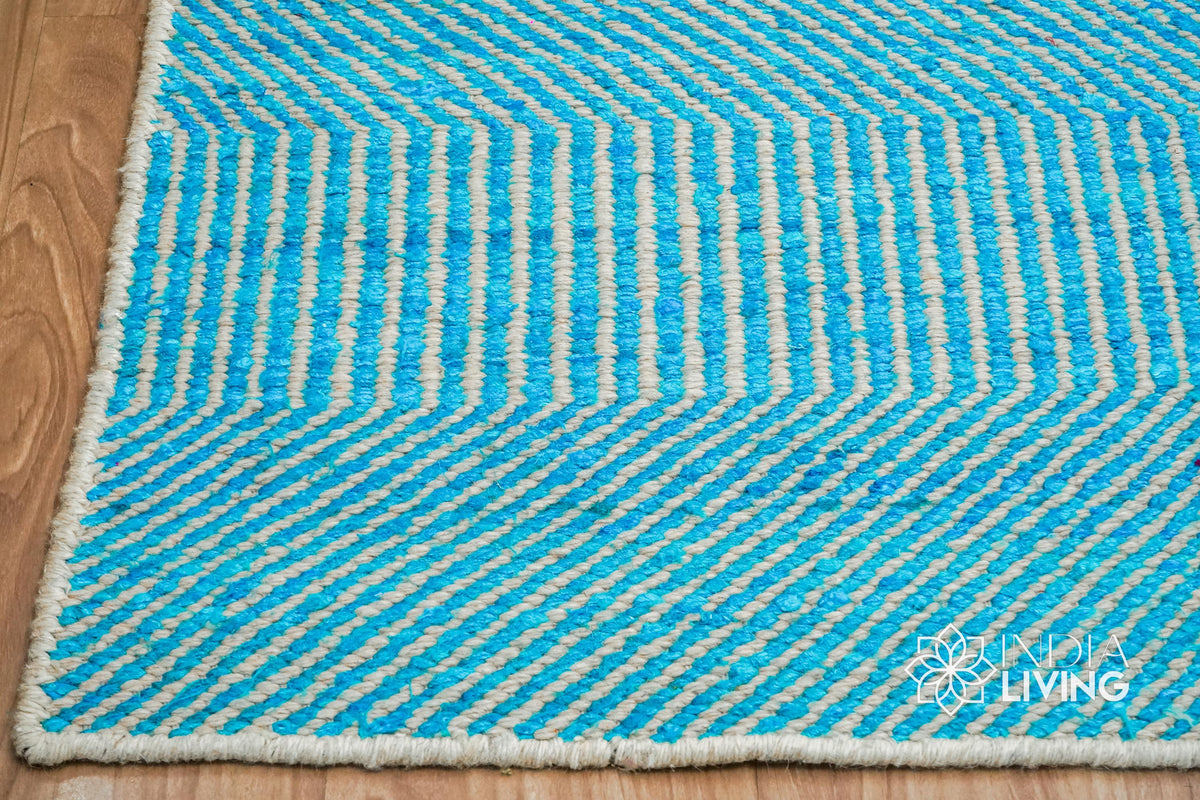 Aqua blue wool rug texture close-up showing handwoven wavy weave